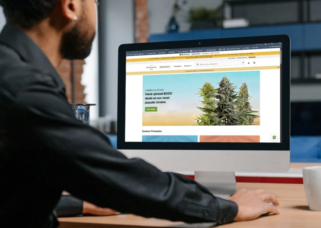 5 Best Cannabis Affiliate Programs of 2025 That Actually Convert & Pay 8 Laptop screen showing Seedsman cannabis seed website homepage with menu navigation and featured strains